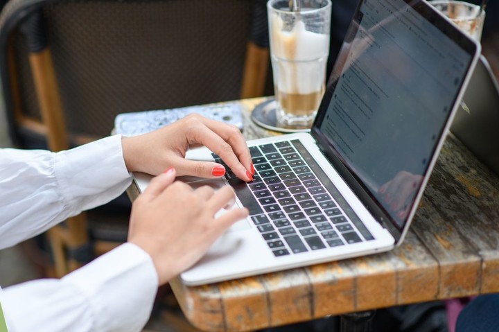 Picture of hands with laptop and lettering: Business School newsletter for current students, prospective students and alumni